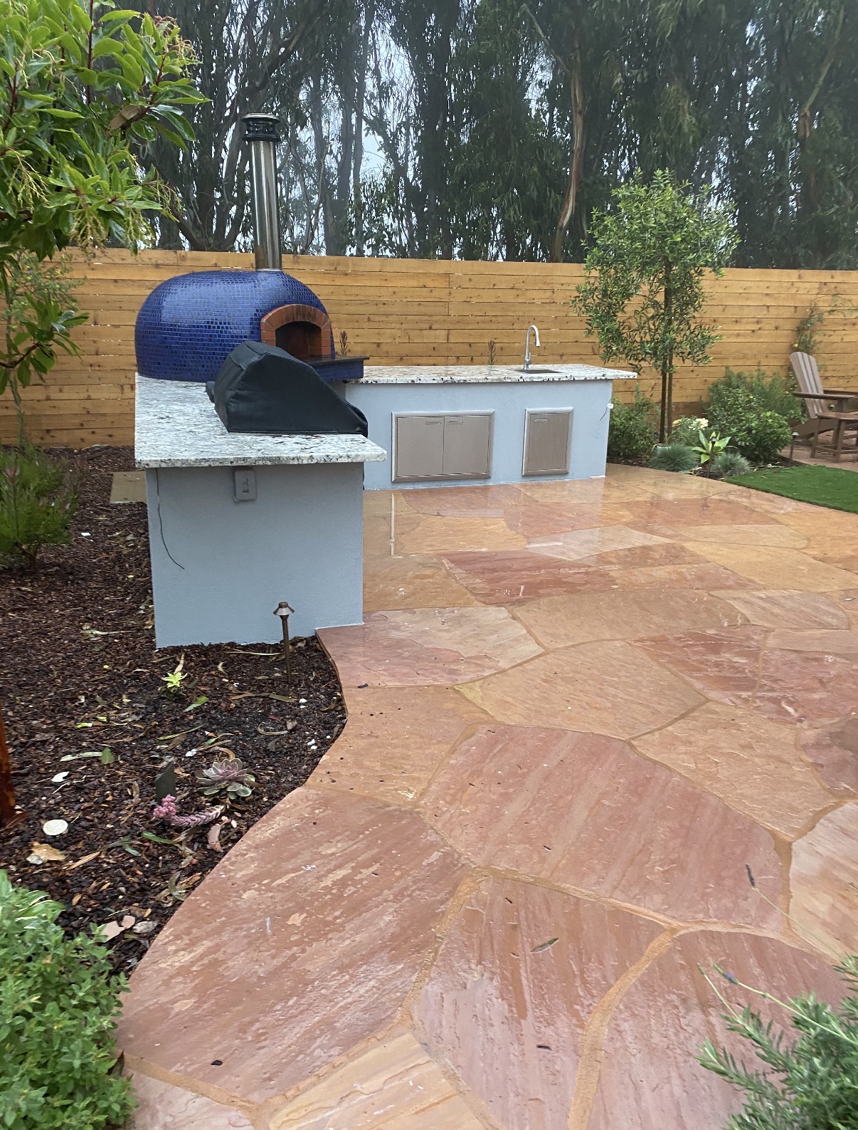 Outdoor kitchen with pizza oven
